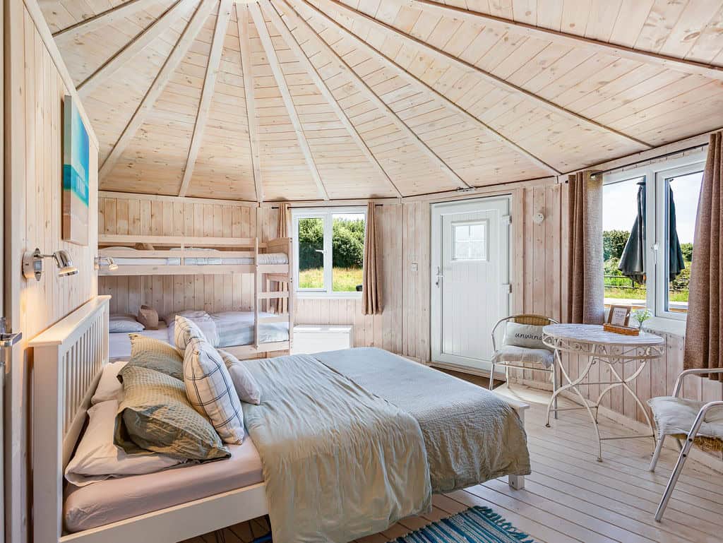 Sandy Mouth family cabin interior with king-size bed and bunk beds