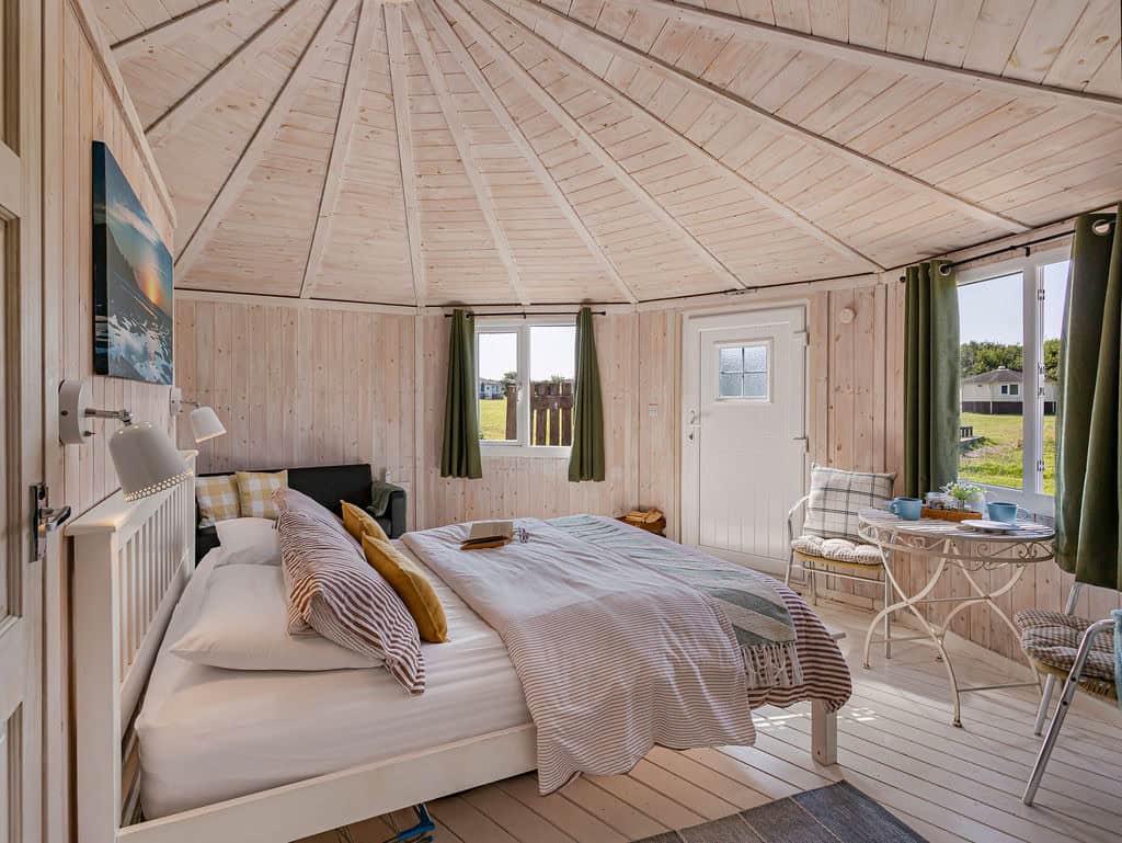 Berry Bay couples cabin interior with king-size bed